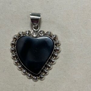 Vintage Taxco Mexico sterling silver pendant with heart shaped onyx stone.